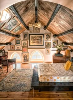 a bedroom with pictures on the walls and ceiling