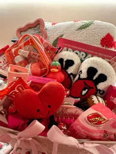 a basket filled with valentine's day treats and candies for someone to eat