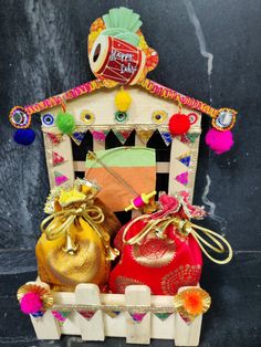 an assortment of colorful bags sitting on top of a wooden bench next to a black wall