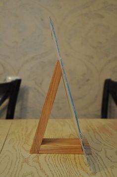 a small wooden triangle on top of a table