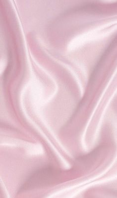 a close up view of a pink satin fabric