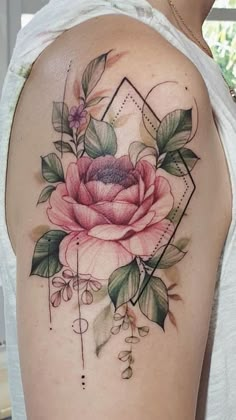 a woman's arm with a rose tattoo on it