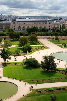 an aerial view of a park with people walking around