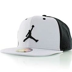 a white and black hat with the air jordan logo on it