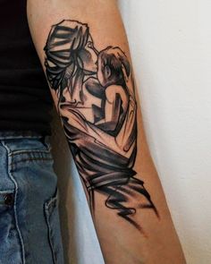 a woman's arm with a tattoo on it that has an image of two people hugging