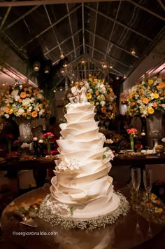 a white wedding cake sitting on top of a table