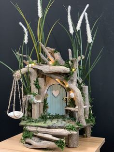 a fairy house made out of drift wood