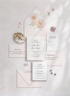 the wedding stationery is laid out and ready to be put into their guests'envelopes