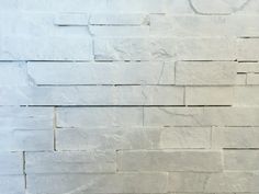 a white brick wall with no mortars on it