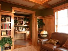 a living room filled with furniture and bookshelves