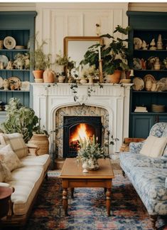 a living room filled with furniture and a fire place