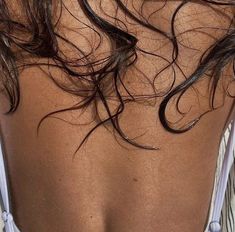 the back of a woman with wet hair