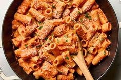 a skillet filled with pasta and sauce