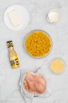 ingredients to make chicken and rice casserole laid out on a white counter top