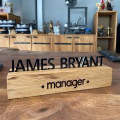 a wooden sign sitting on top of a table