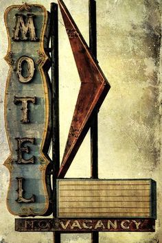 an old motel sign is shown with the word motel on it's front and side