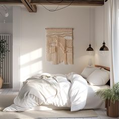 a bed with white linens and pillows in a bedroom next to a wall hanging