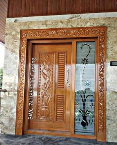 an ornate wooden door with glass inserts