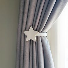 a curtain with a yellow star on it