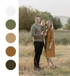 a man and woman are standing in a field with their arms around each other as they smile at the camera