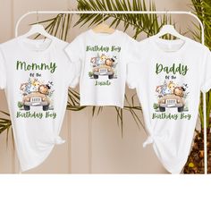 two t - shirts hanging on a clothesline with the words mommy and daddy printed on them