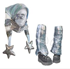 a pair of silver boots with stars attached to the soles and one wearing glasses