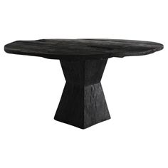 an oval black table with wooden legs and a circular top, on a white background