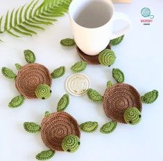 crocheted sea turtle coasters next to a coffee cup