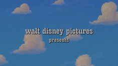 the words walt disney pictures are in front of some clouds