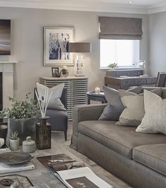 a living room filled with furniture and a fire place