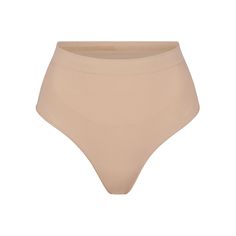 A stretchy shapewear thong that hits at the mid waist for a flat tummy, cinched waist, plus an interior underband with silicone to prevent it from rolli... Waist Shapewear, Mid Thigh Shorts, Shapewear Bodysuit, Flat Tummy, Sculpting Clay, Under Dress, Slipcovered Sofa, Cinched Waist, Lace Bra