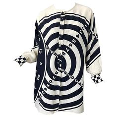 Rare 80s MOSCHINO Cheap & Chic black and white / ivory novelty bulls eye print Size 8 Rayon slouchy shirt tunic / mini dress ! Features fabric covered buttons up the front and at each sleeve cuff. POCKETS at each side of the hips. Checkered print sleeves. Can easily be dressed up or down, belted or alone. Perfect with leggings. In great conditon Made in Italy Marked Size 8, but could also fit larger, as it is oversized Measurements: 44 inch bust 44 inch waist 50 inch hips 31 inches from top back Cherry Shirt, 1980’s Fashion, Slouchy Shirt, Artsy Outfit, Moschino Cheap And Chic, Eye Print, Printed Sleeves, Fabric Covered, Tunic Dress