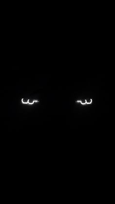 two eyes are glowing in the dark