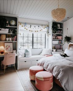 a bedroom with white walls and pink furniture