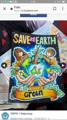 someone holding up a book that says save the earth