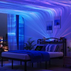 a bedroom with purple and blue lights on the ceiling