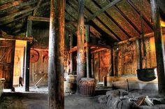 the inside of an old wooden building with lots of wood