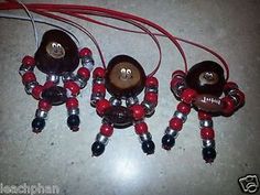 three red and black beads are attached to the same device with wires running through them