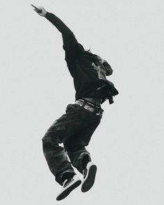 a man flying through the air while riding a skateboard in front of a white sky