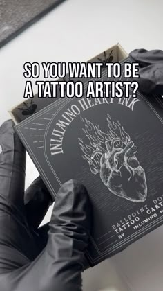 someone holding up a tattoo book with the caption so you want to be a tattoo artist?