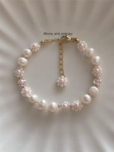 Beautiful freshwater pearls & beaded flowers. It looks so gorgeous and stunning! -Materials 11/0, 15/0 Glass beads (Made in Japan) Freshwater pearl (4~5mm=0.15~0.2Inch) Adjuster chain -Length About 19cm=7.4Inch (Include 4cm=1.5Inch Adjuster Chain) -And More If you need to change bracelet length shorter or longer, then please contact me. I can change adjuster chain's length. Or if you need to change color, then contact to me. -Note Please avoid from water, then jewelry keep shining. Beaded jewelr Pearl Bracelet Ideas, Bracelets With Pearls, Beaded Flower Bracelet, Holiday Bracelets, Keep Shining, Bracelets Design, Diy Bracelet Designs, Jewelry Making Project, Dope Jewelry