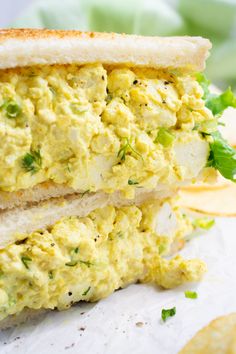 an egg salad sandwich cut in half with lettuce