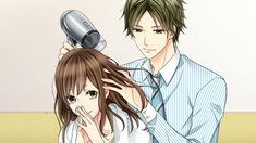 a woman blow drying her hair next to a man