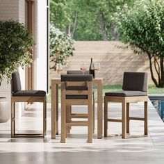 a table and chairs sitting next to a pool