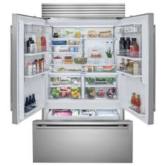 an open refrigerator with its doors wide open and full of fresh food, including fruits and vegetables