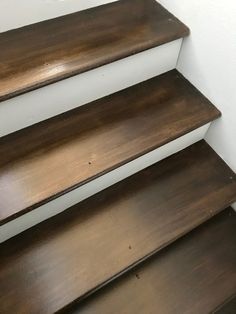 three wooden shelves sitting on top of each other