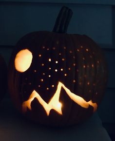 a carved pumpkin sitting on top of a table