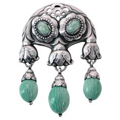 Georg Jensen large rare design Silver Amazonite Master Brooch, C.1933. Designed as foliate motifs set with 2 oval amazonite and suspending three amazonite acorn shaped drops. Measures: 9.00 x 6.50 cm, 1933-44 marks GJ in box 925 Sterling Denmark design number 137. Item Weight: 62.34 grams. Very good condition, no issues. Ref: Georg Jensen Jewelry David A. Taylor P 36 Fig 1-24 original Georg Jensen drawing and P226 similar design in amber and malachite. P.91 Georg Jensen Tradition of Splendid Silver Drucker Georg Jensen Jewelry, Resin Polymer Clay, Upcycled Jewelry, Georg Jensen, Design Silver, Fig, Metal Working, Bead Work, Georgia