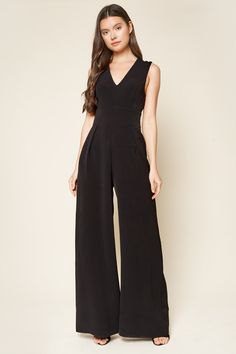 Our hottest jumpsuit just got even better! The Klara Wide Leg Jumpsuit is ideal to take from day to night. Formed by a woven poly fabric, v-neckline and pleated detailing that leads to a wide leg pant. All you need is a great pair of heels to make your outfit complete!- Wide leg jumpsuit- V-neck- Sleeveless- Pleated front detailSize + Fit- Model is 5'8" and wearing size S- Measurements taken from size S- Chest: 30 1/2"- Inseam: 32"FabricSelf: 95% Polyester, 5% Spandex, Lining: 100% PolyesterStyl Light Blue Jumpsuit, Mother Of The Bride Suits, Blush Fabric, Pleated Pant, Flowy Romper, Make Your Outfit, Hot Jumpsuits, Silk Romper, Formal Jumpsuit