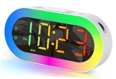 an alarm clock with multicolored display on the front and back sides is shown